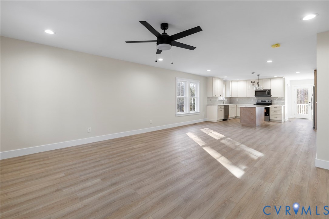 320 Vogel Road Cumberland, VA 23040 - Photo 5 of 28 a view of a kitchen with a stove cabinets and wooden floor