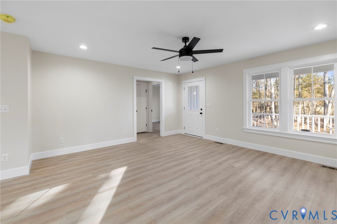 320 Vogel Road Cumberland, VA 23040 - Photo 6 of 28 a view of empty room with wooden floor and fan