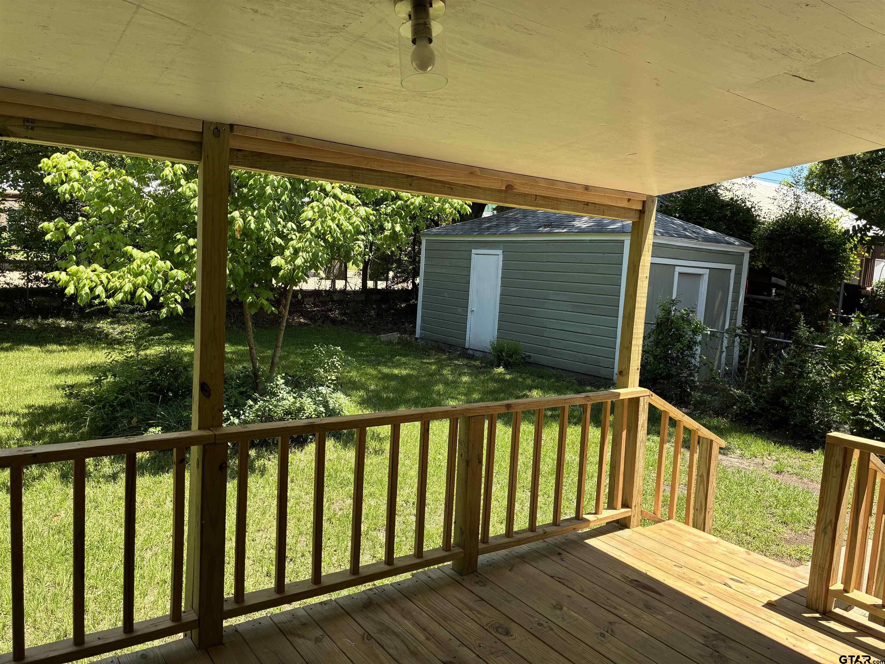 811 West 5th Street Tyler, TX 75701 - Photo 18 of 26 a view of a wooden deck and a yard
