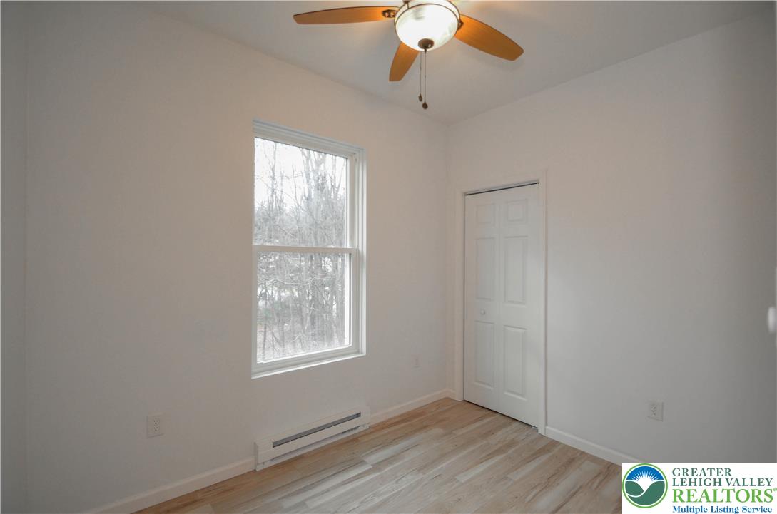 2 Elm Street Mount Pocono, PA 18344 - Photo 28 of 44 a view of an empty room with wooden floor and a window