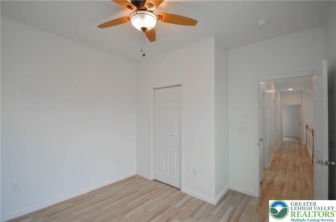 2 Elm Street Mount Pocono, PA 18344 - Photo 29 of 44 a view of a hallway with wooden floor and a chandelier fan
