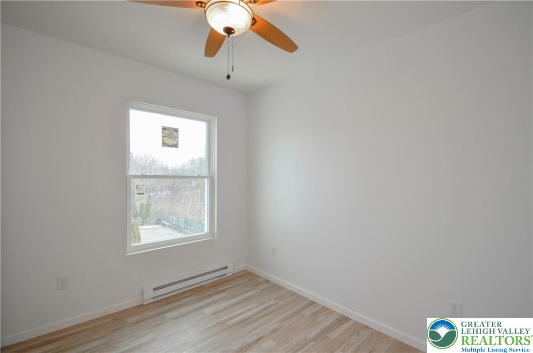 2 Elm Street Mount Pocono, PA 18344 - Photo 30 of 44 an empty room with a window and a fan