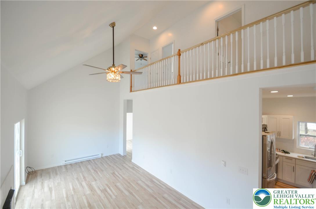 2 Elm Street Mount Pocono, PA 18344 - Photo 6 of 44 a view of a hallway with chandelier