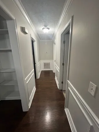 a view of a hallway with staircase