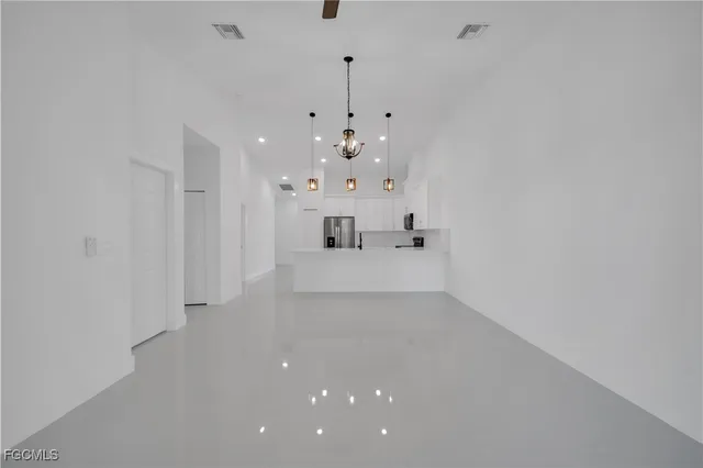 a view of a hallway with a window