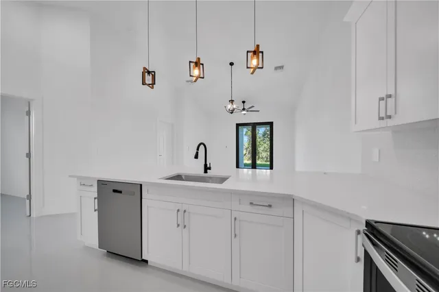 a view of a living room hardwood floor and a ceiling fan