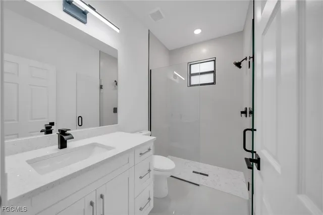 a spacious bathroom with a shower sink