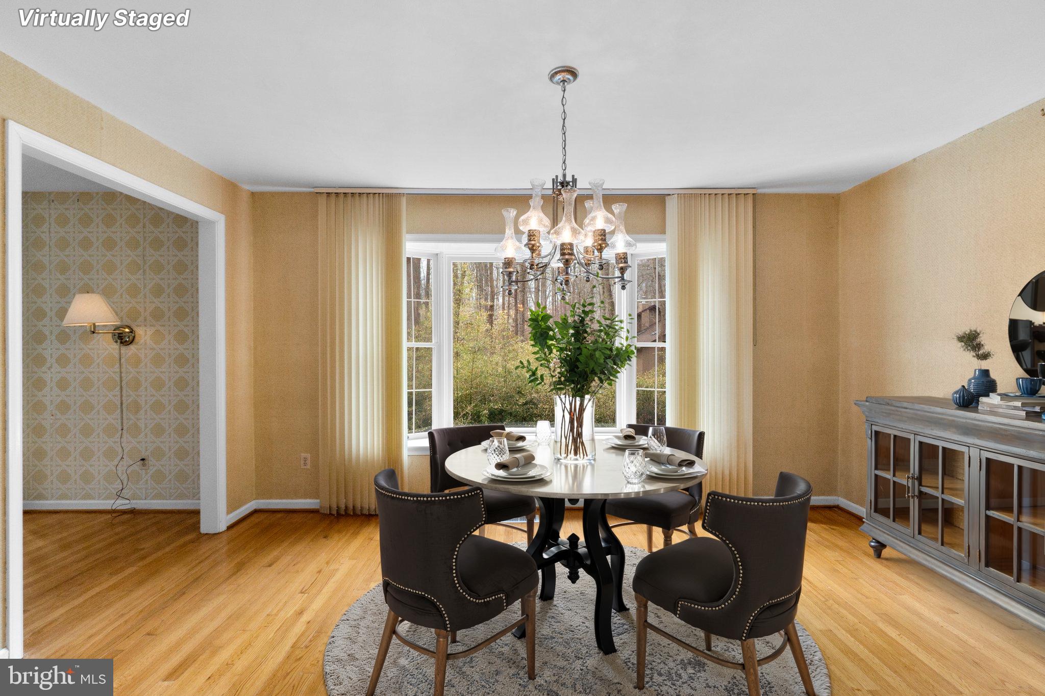 12238 Etchison Road Ellicott City, MD 21042 - Photo 11 of 49 a view of a dining room with furniture window and wooden floor