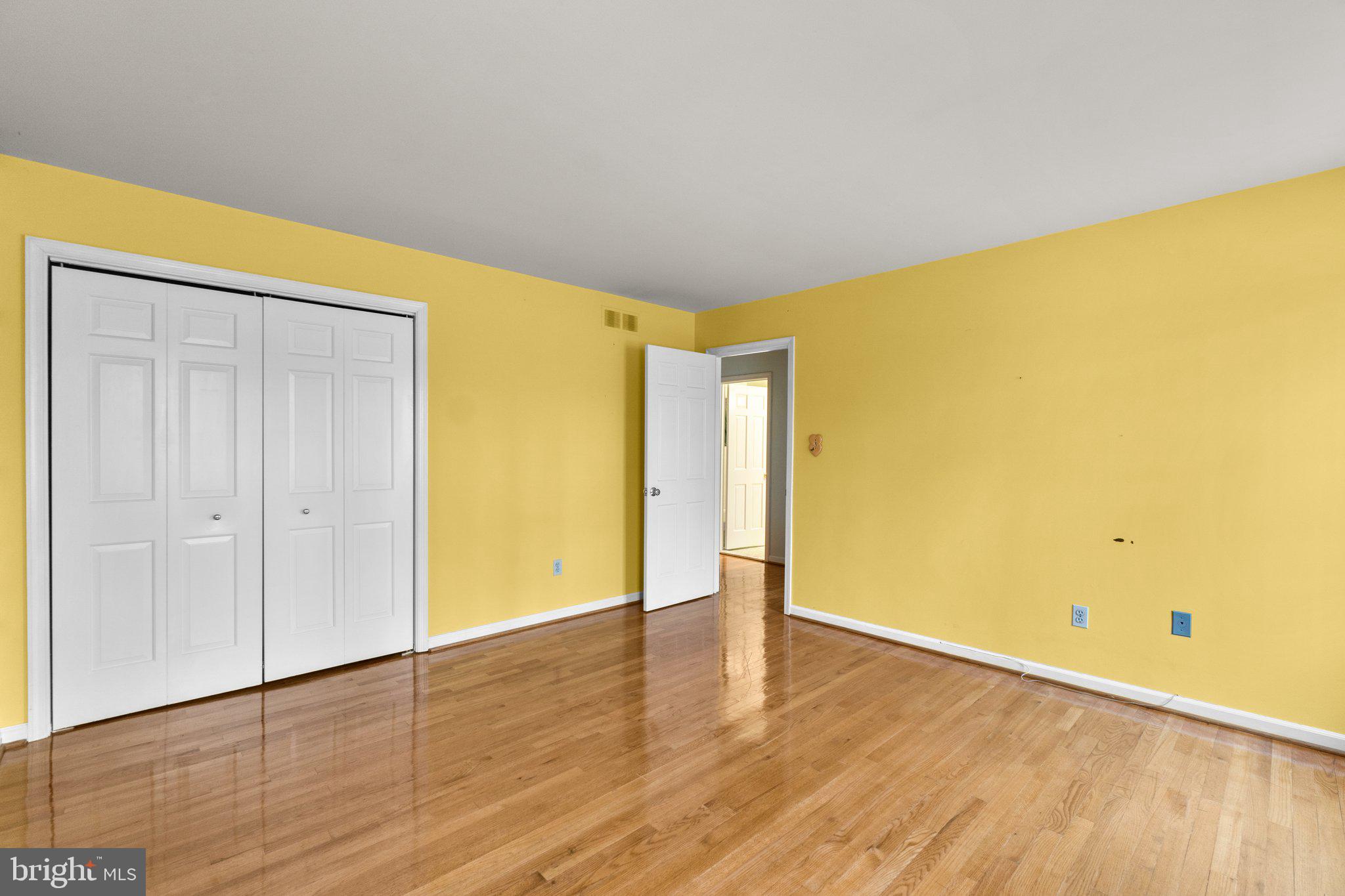 12238 Etchison Road Ellicott City, MD 21042 - Photo 35 of 49 a view of empty room with wooden floor