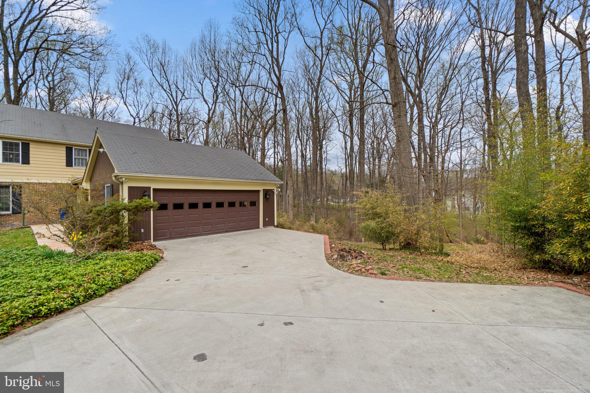 12238 Etchison Road Ellicott City, MD 21042 - Photo 4 of 49 a view of house with outdoor space and trees