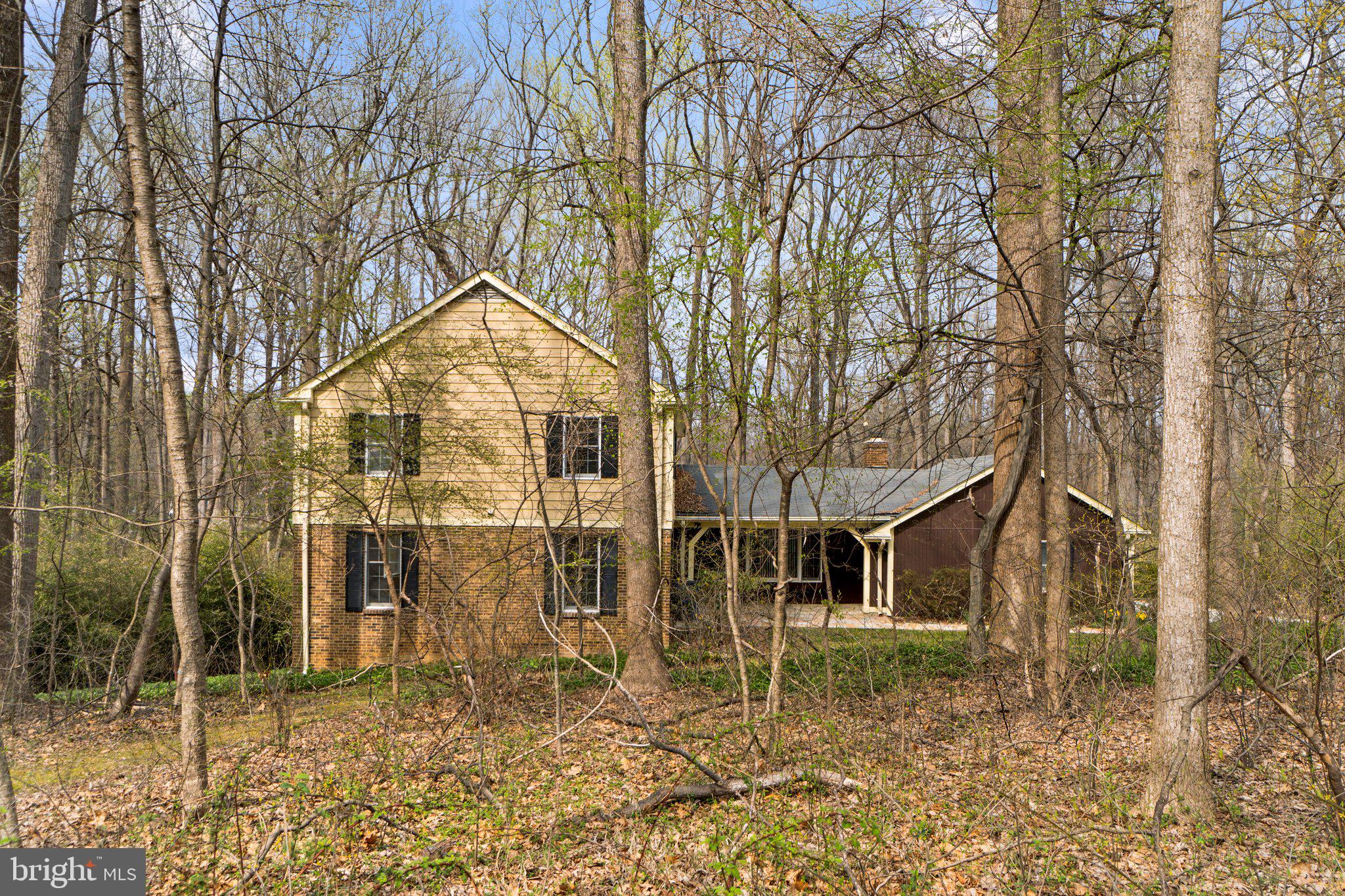 12238 Etchison Road Ellicott City, MD 21042 - Photo 48 of 49 a backyard of a house with table and chairs