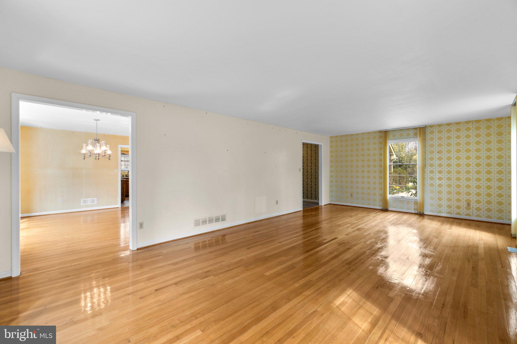 12238 Etchison Road Ellicott City, MD 21042 - Photo 8 of 49 a view of an empty room with wooden floor and a window