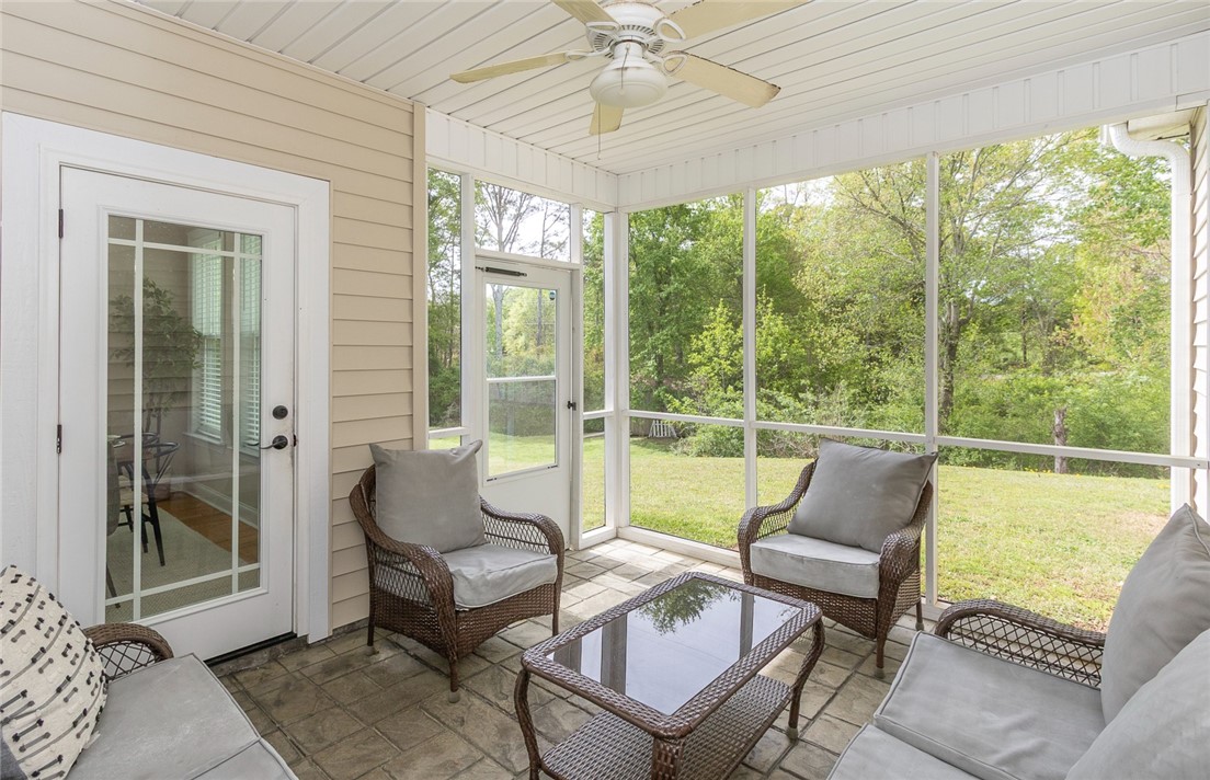 234 Streams Way Anderson, SC 29625 - Photo 40 of 44 Relax and unwind in this serene screened porch, offering picturesque views of lush greenery.