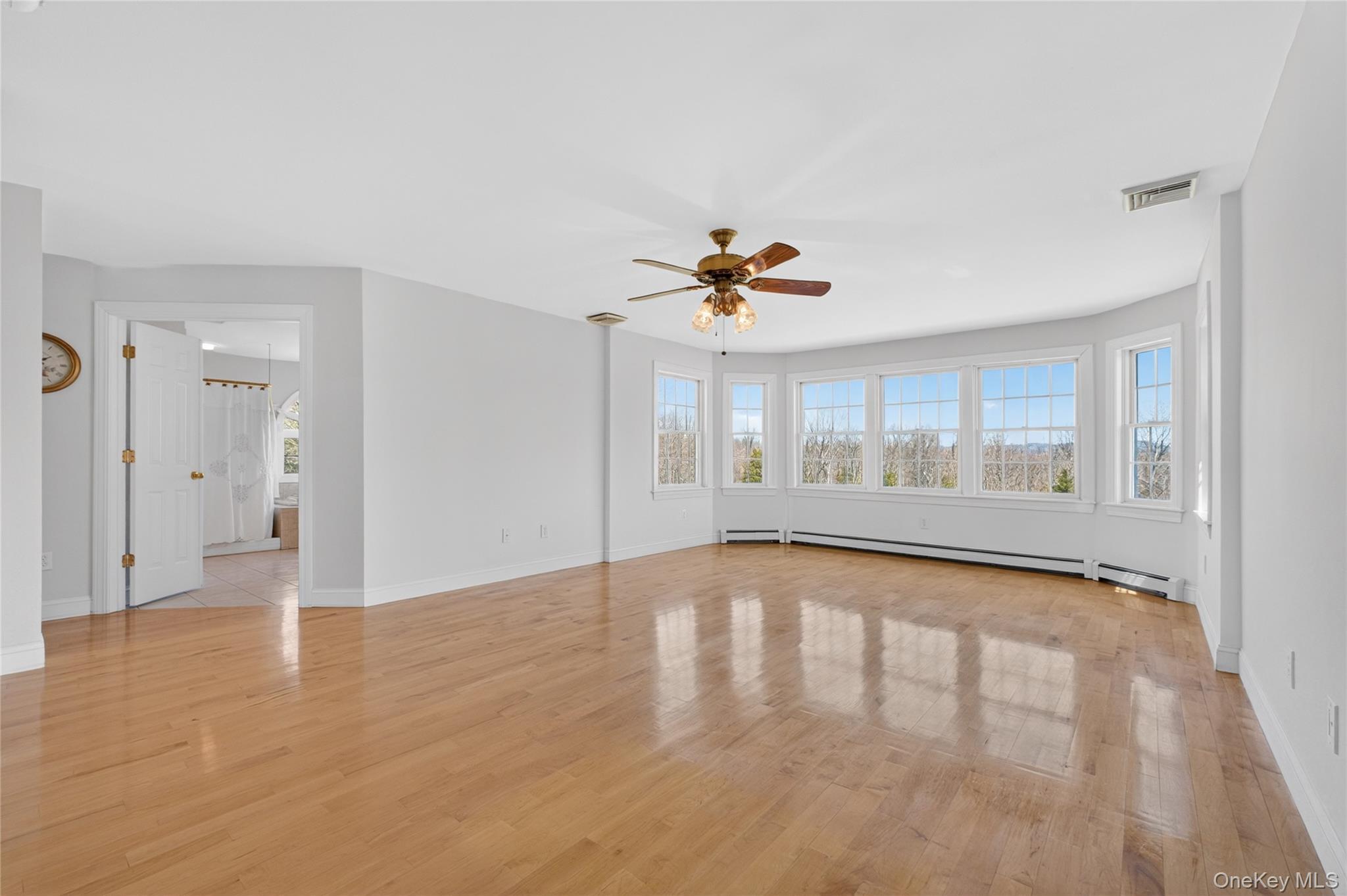 128 Old Pawling Road Pawling, NY 12564 - Photo 13 of 31 a view of an empty room with a window and wooden floor