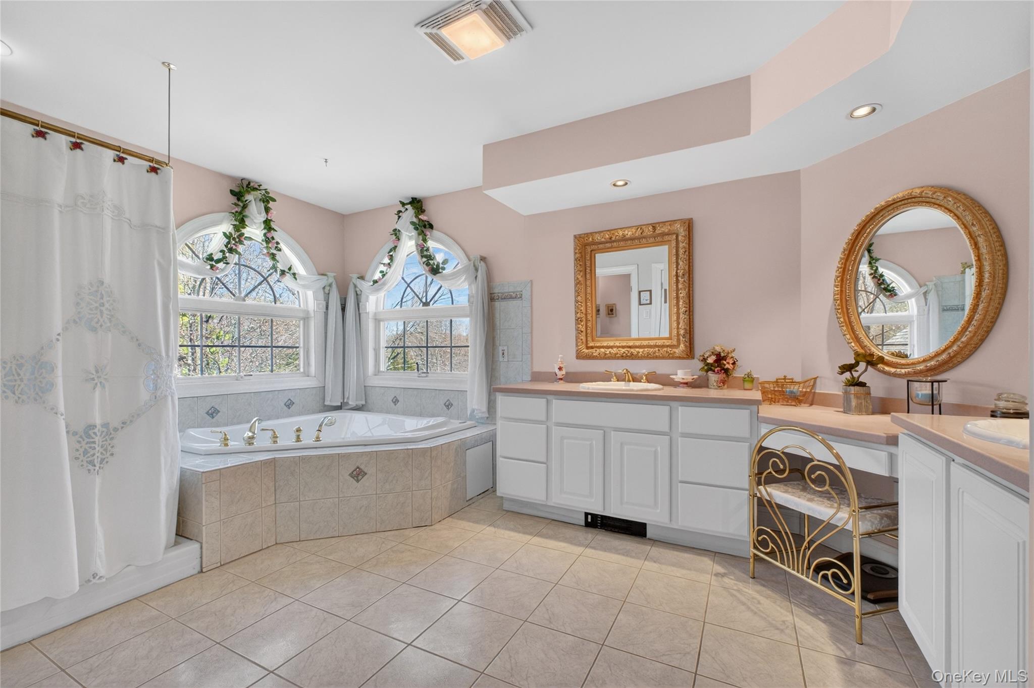 128 Old Pawling Road Pawling, NY 12564 - Photo 16 of 31 a large bathroom with a double vanity sink a mirror a bathtub and a window