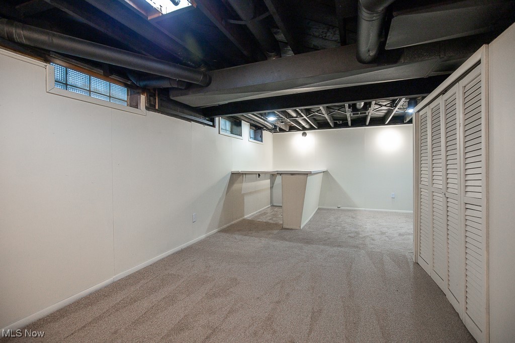 3136 Becket Road Cleveland, OH 44120 - Photo 32 of 39 Basement with plenty of natural light and light colored carpet