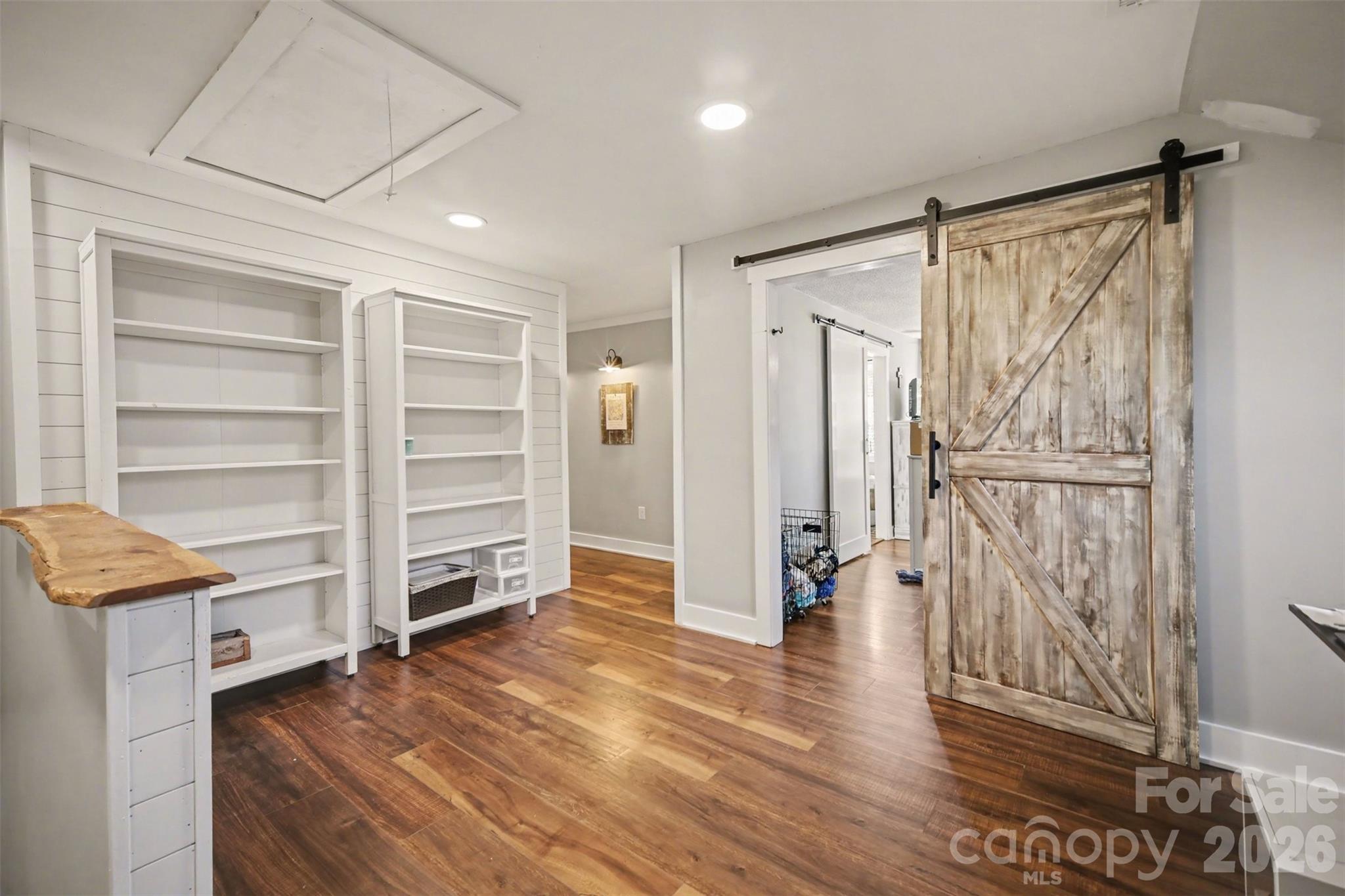 5226 Old Plank Road Iron Station, NC 28080 - Photo 15 of 45 a view of walk in closet with wooden floor and closet