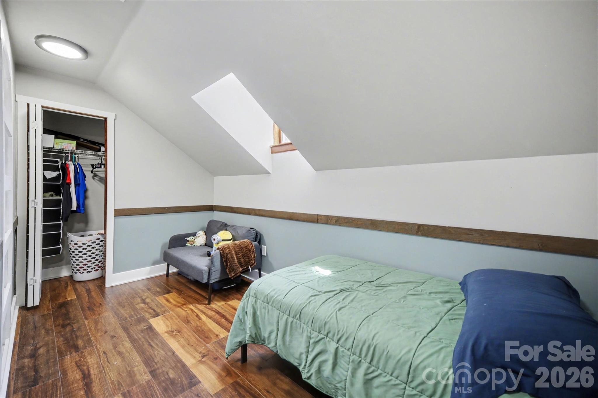 5226 Old Plank Road Iron Station, NC 28080 - Photo 26 of 45 a bedroom with a bed and wooden floor