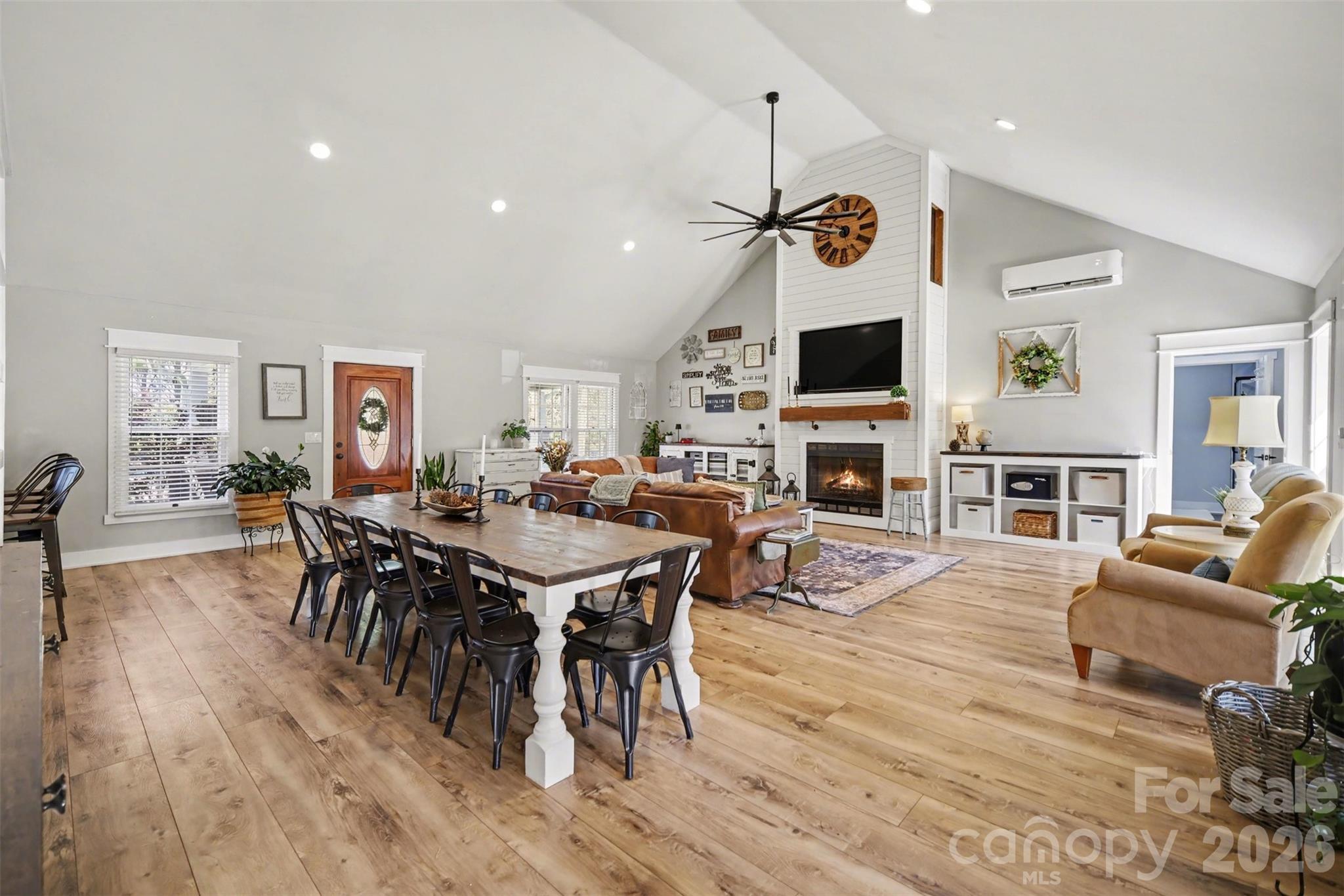 5226 Old Plank Road Iron Station, NC 28080 - Photo 3 of 45 a view of a dining room with furniture wooden floor and a fireplace
