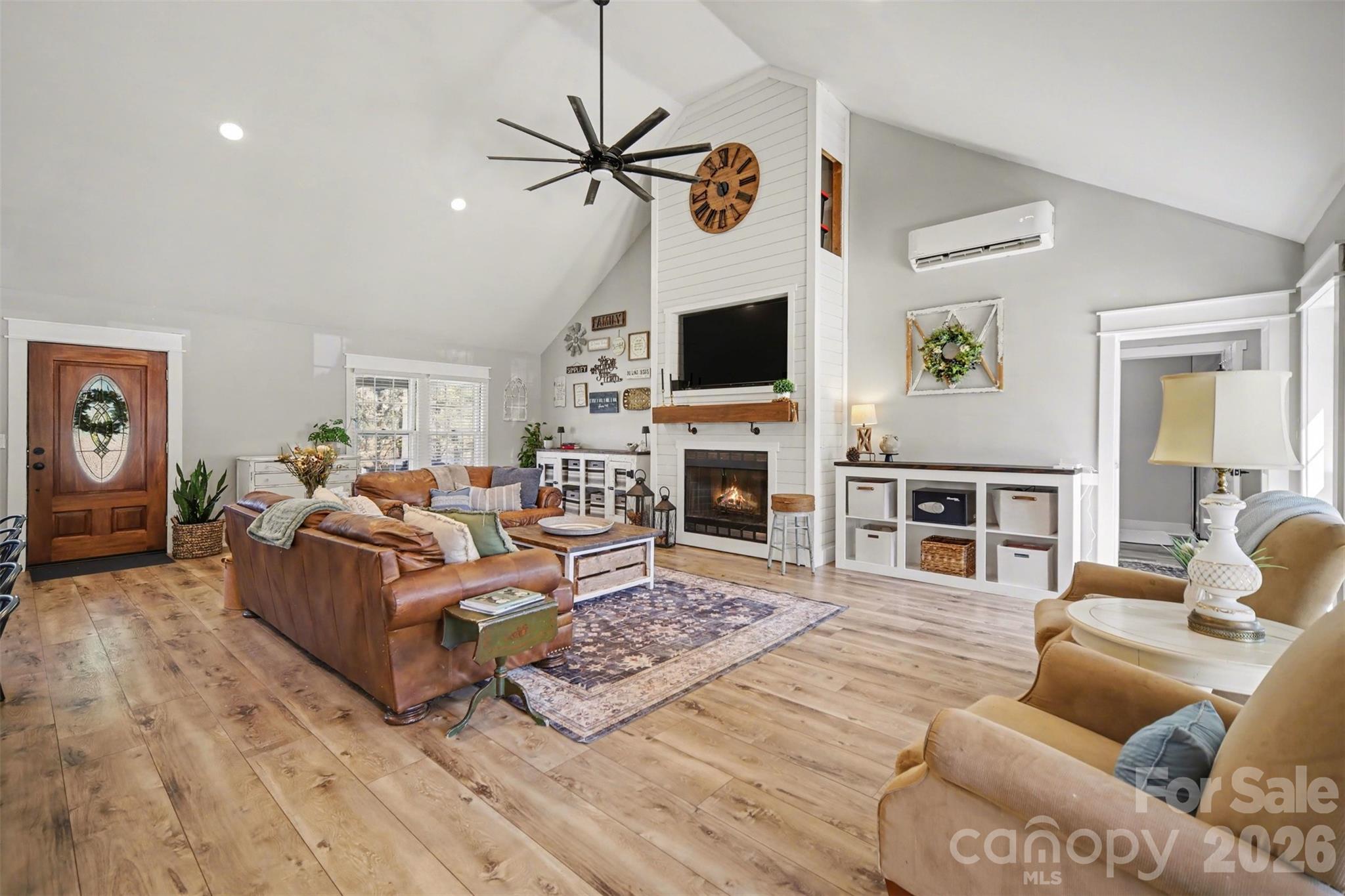 5226 Old Plank Road Iron Station, NC 28080 - Photo 6 of 45 a living room with furniture a flat screen tv and a fireplace