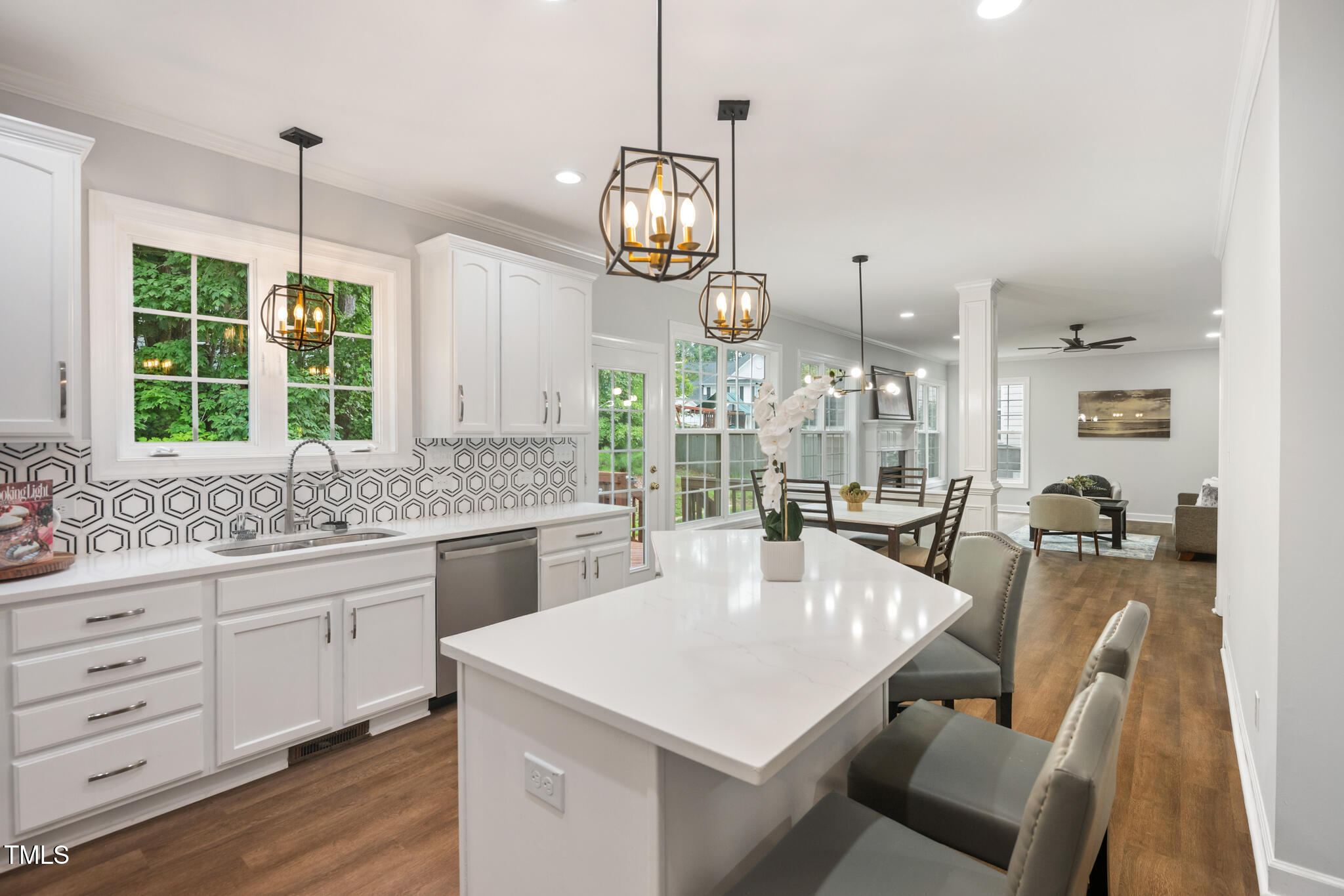1604 Timber Wolf Drive Durham, NC 27713 - Photo 12 of 48 a kitchen with center island and windows