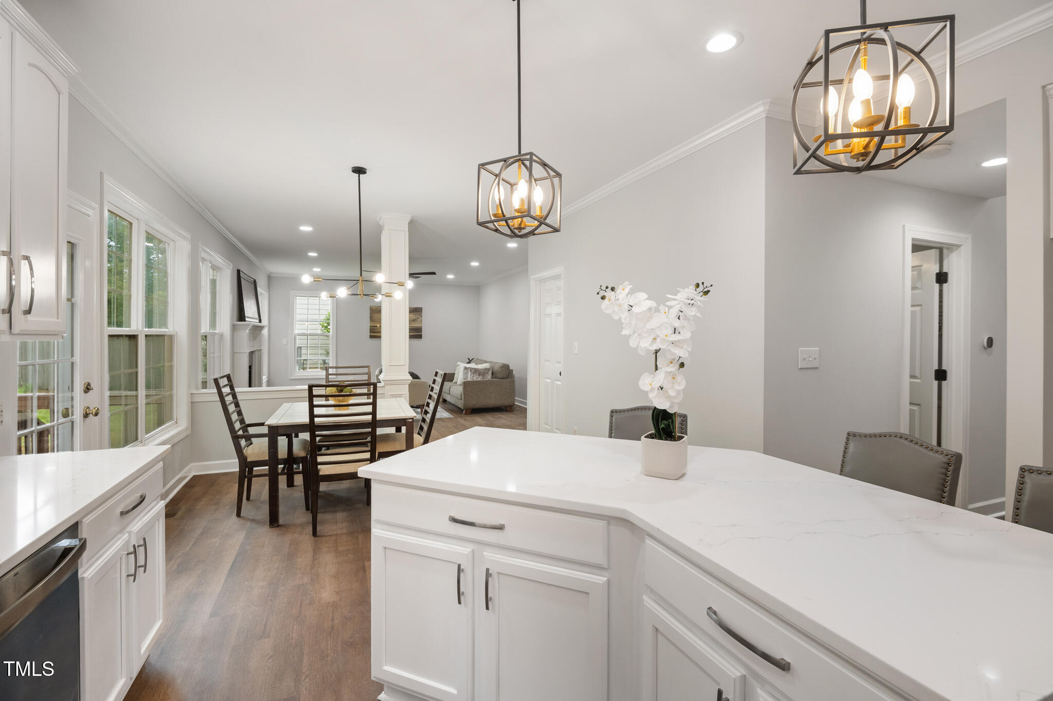 1604 Timber Wolf Drive Durham, NC 27713 - Photo 13 of 48 a view of a dining room with furniture a chandelier and wooden floor