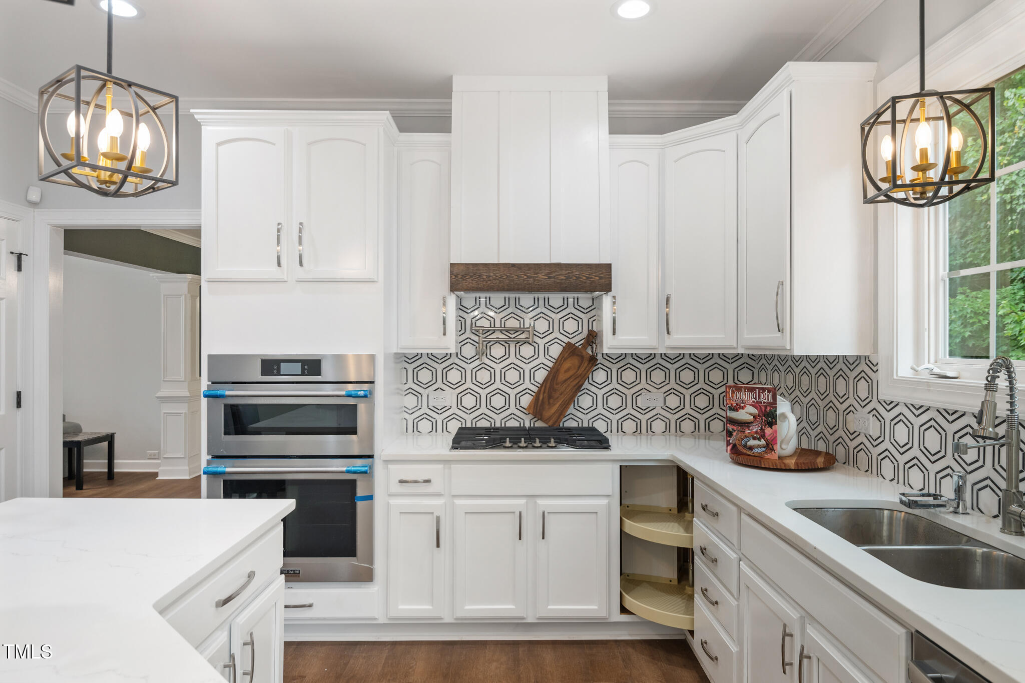 1604 Timber Wolf Drive Durham, NC 27713 - Photo 15 of 48 a kitchen with stainless steel appliances granite countertop a sink and a stove