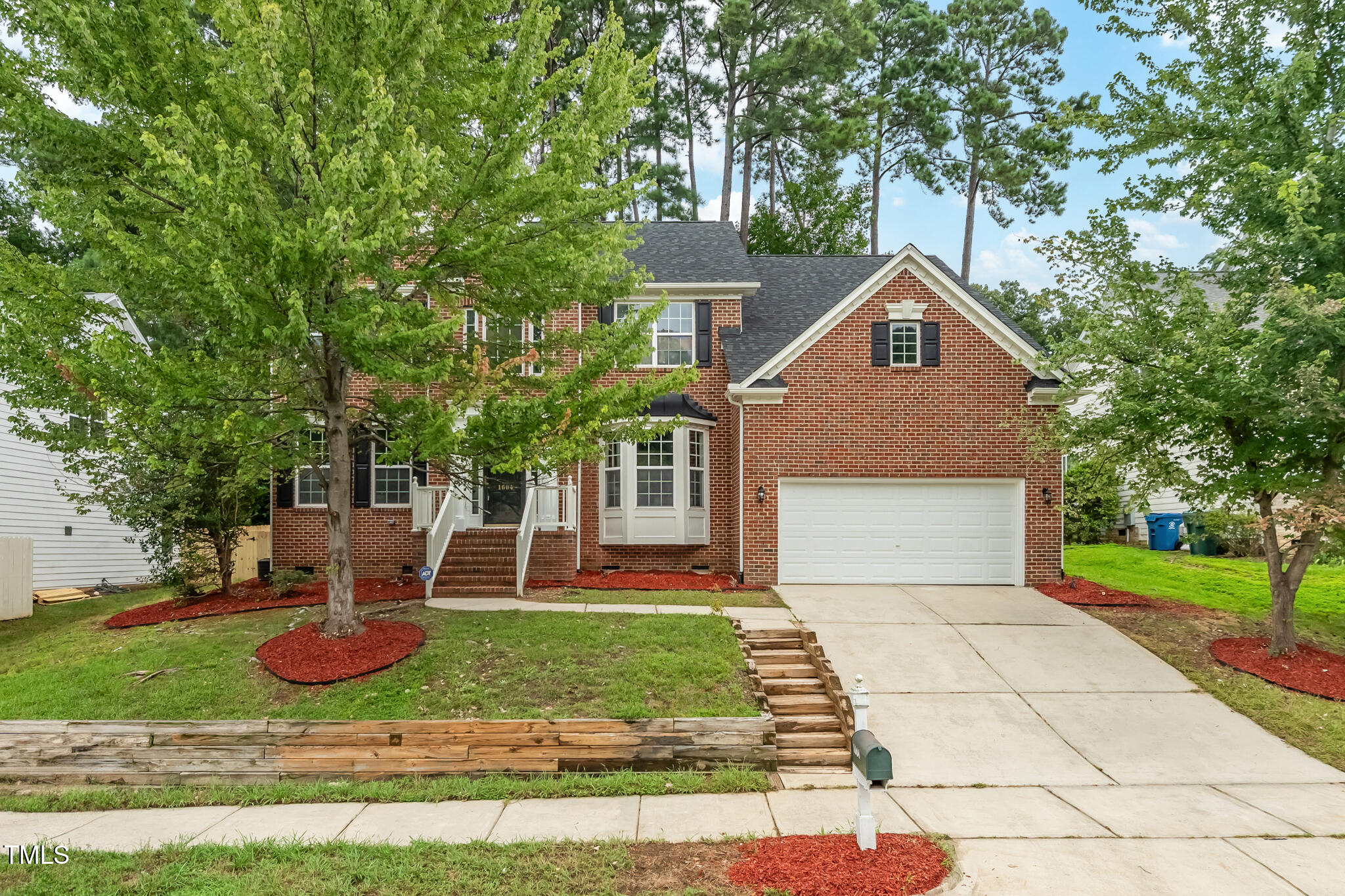 1604 Timber Wolf Drive Durham, NC 27713 - Photo 2 of 48 a front view of a house with a yard