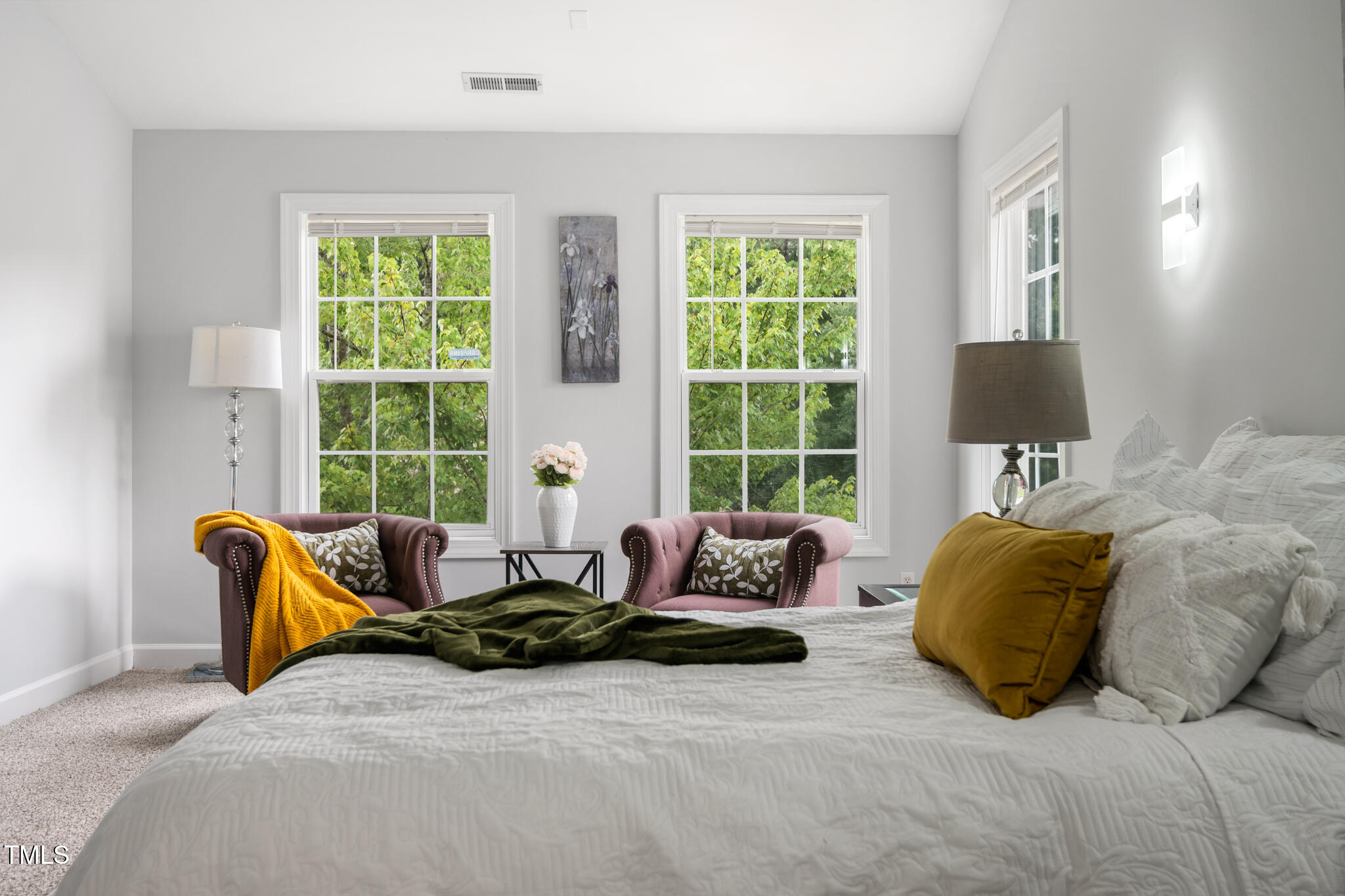1604 Timber Wolf Drive Durham, NC 27713 - Photo 23 of 48 a bedroom with a bed and glass window
