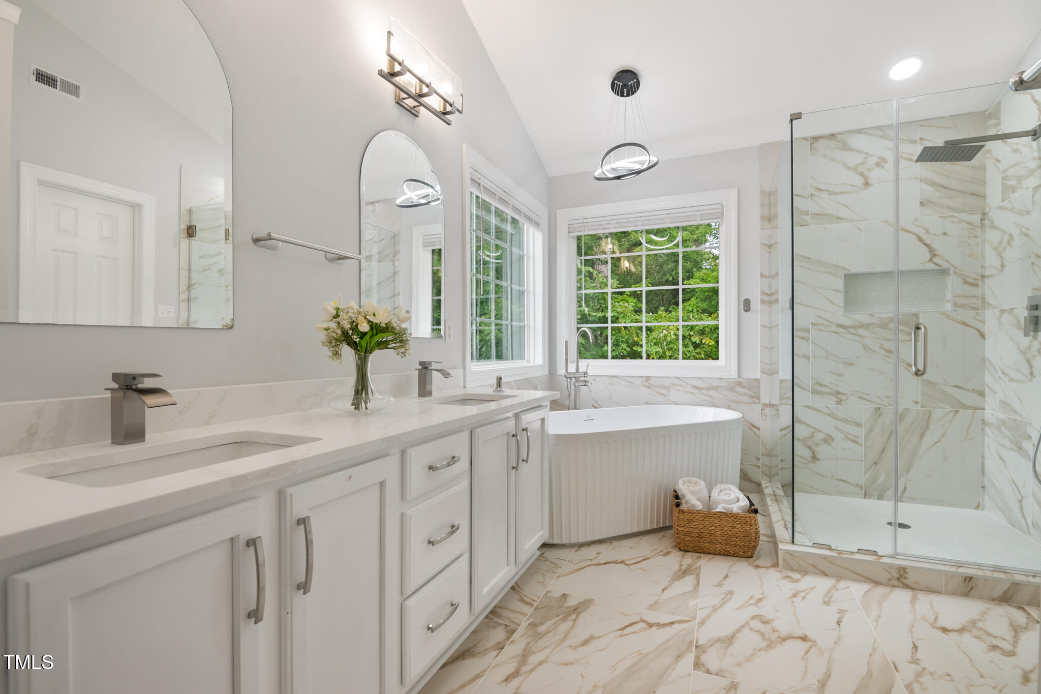 1604 Timber Wolf Drive Durham, NC 27713 - Photo 24 of 48 a bathroom with a tub sink and mirror