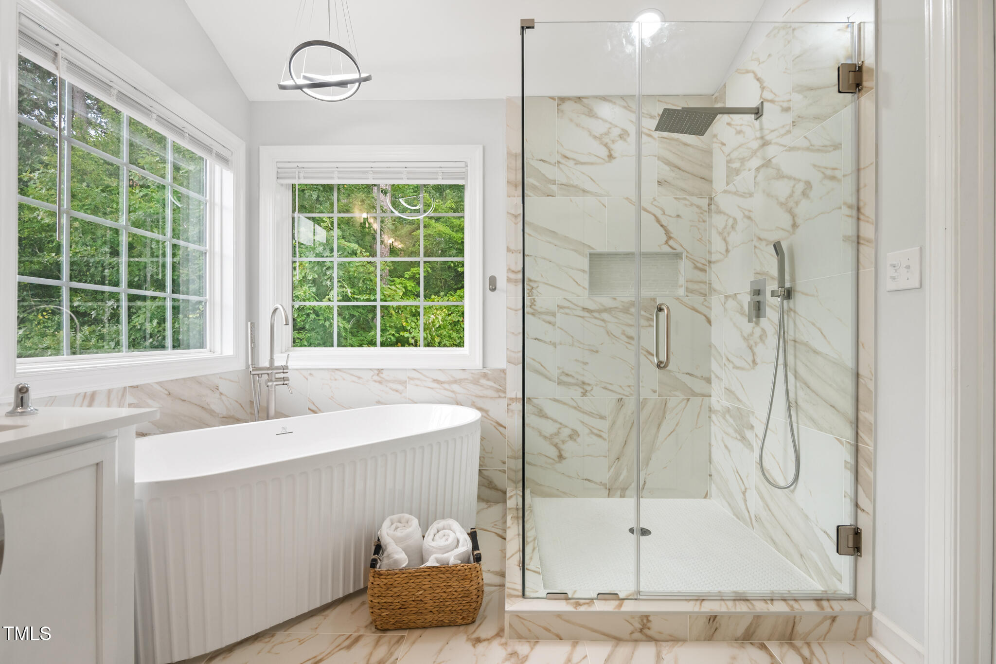 1604 Timber Wolf Drive Durham, NC 27713 - Photo 25 of 48 a bathroom with a tub sink and window