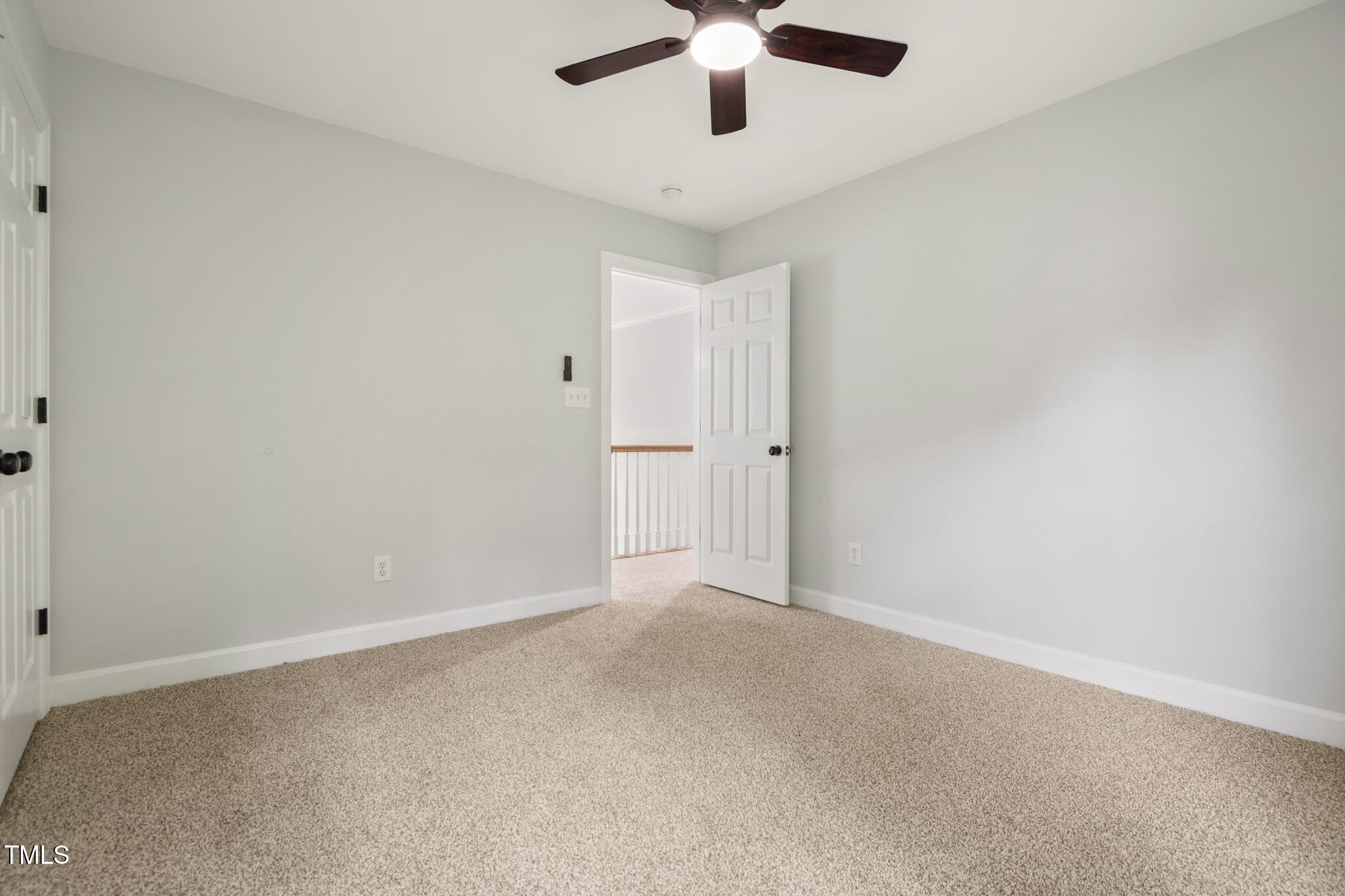 1604 Timber Wolf Drive Durham, NC 27713 - Photo 30 of 48 an empty room with a chandelier fan and windows