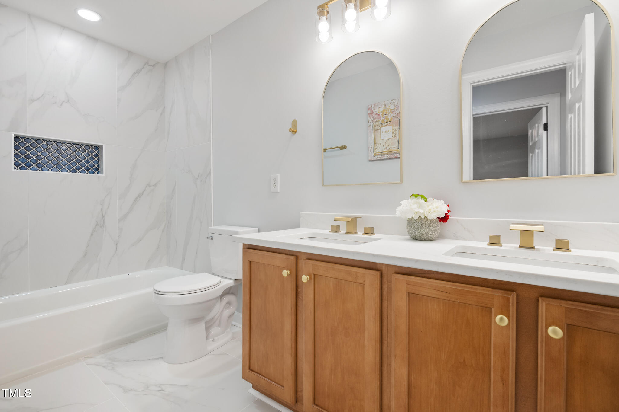 1604 Timber Wolf Drive Durham, NC 27713 - Photo 34 of 48 a bathroom with a granite countertop sink mirror vanity and toilet