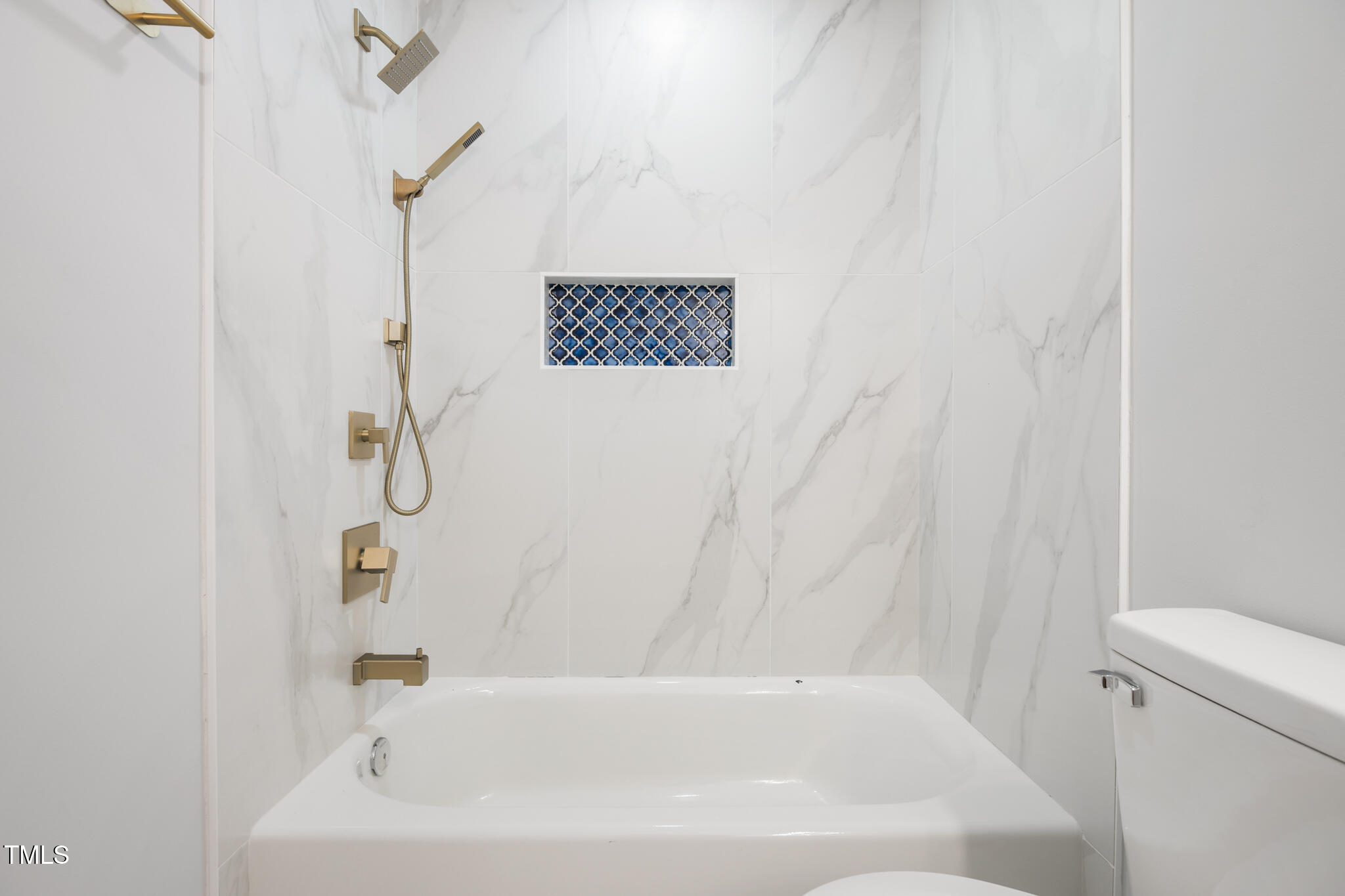 1604 Timber Wolf Drive Durham, NC 27713 - Photo 35 of 48 a bathroom with a bathtub and a shower