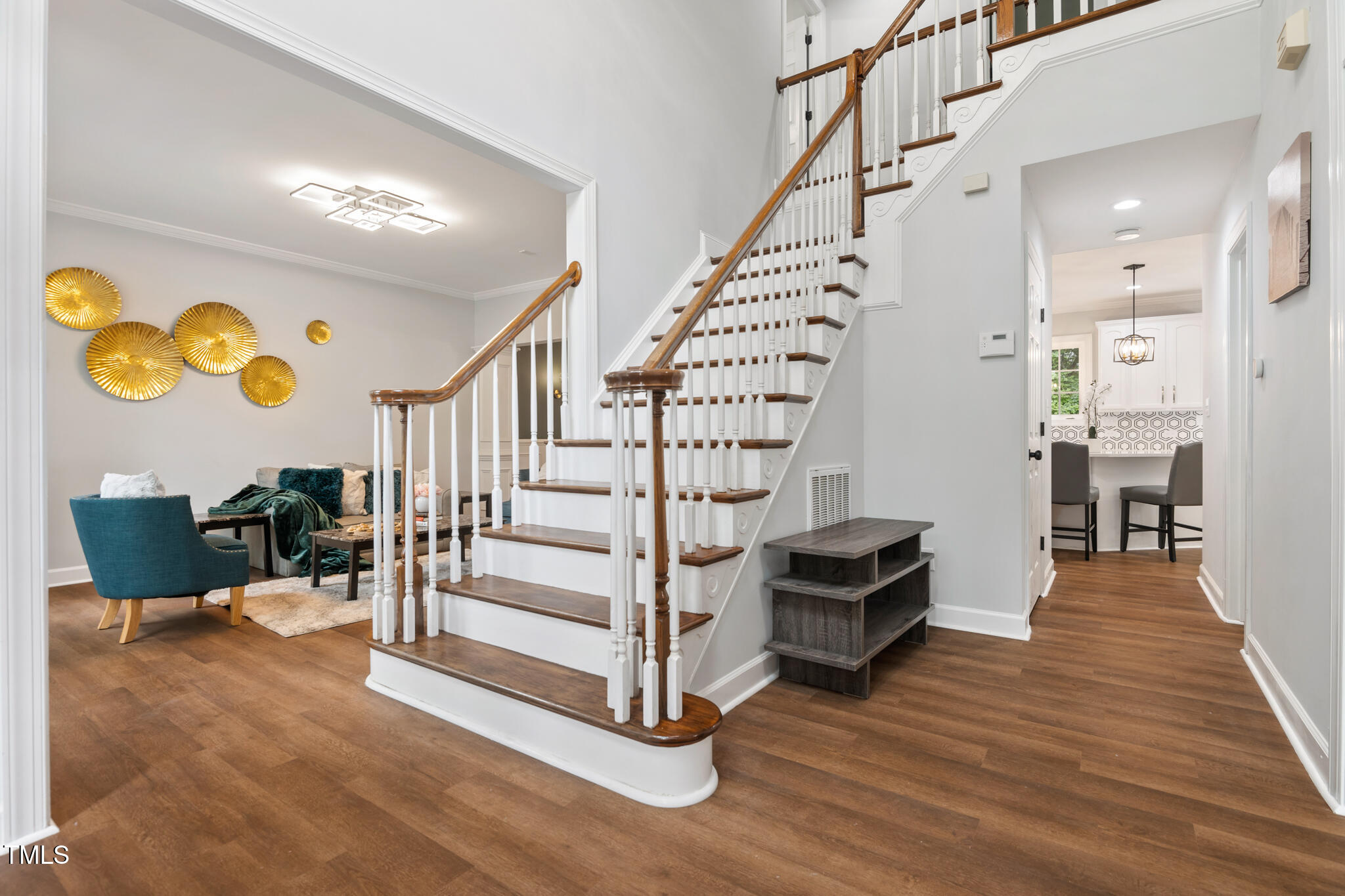 1604 Timber Wolf Drive Durham, NC 27713 - Photo 4 of 48 a view of entryway with wooden floor and stairs