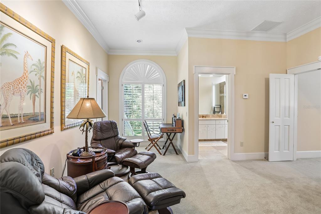 17810 Crawley Road Odessa, FL 33556 - Photo 36 of 76 a living room with furniture and floor to ceiling windows