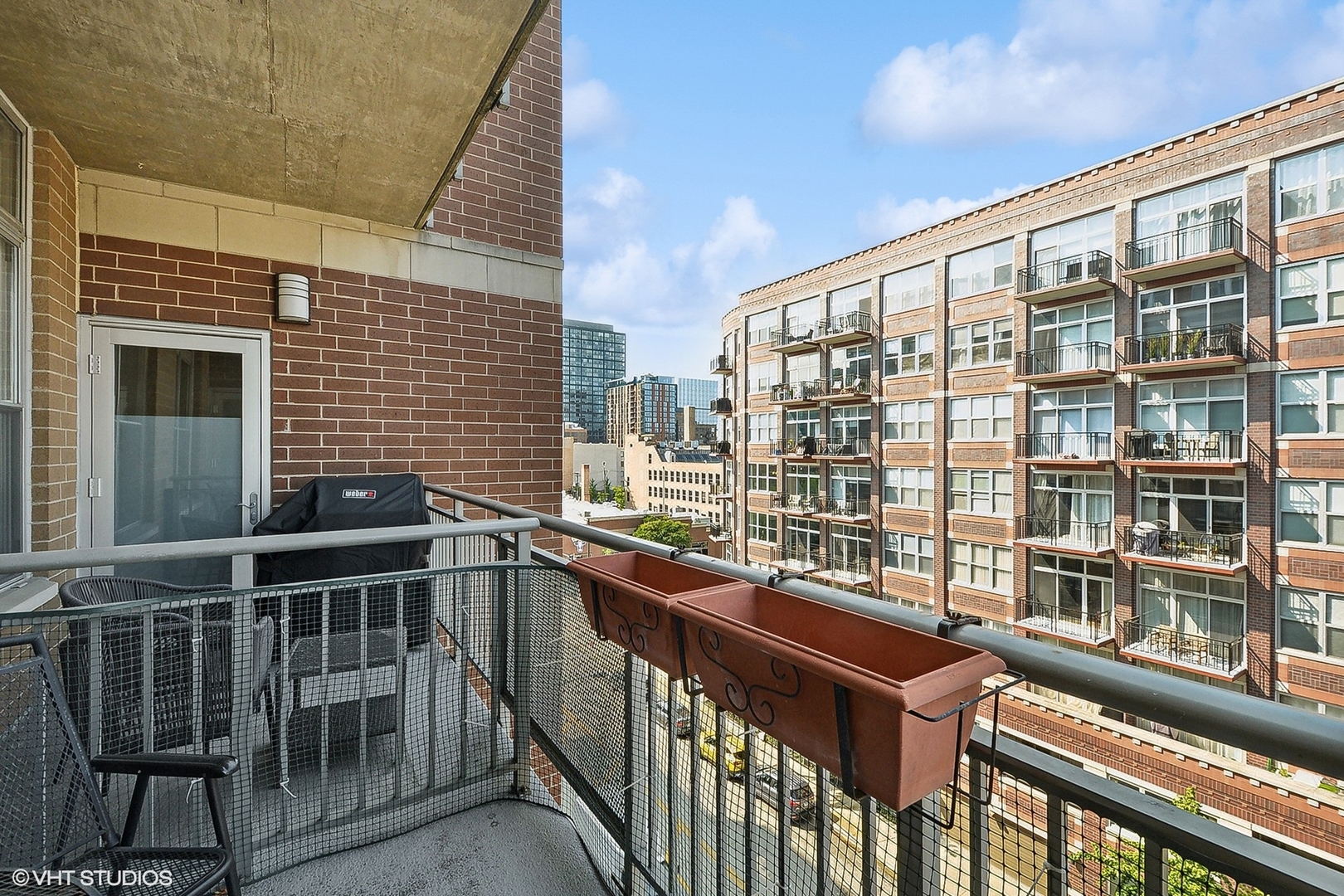 111 South Morgan Street, Unit 607 Chicago, IL 60607 - Photo 11 of 12 a view of a building from a balcony