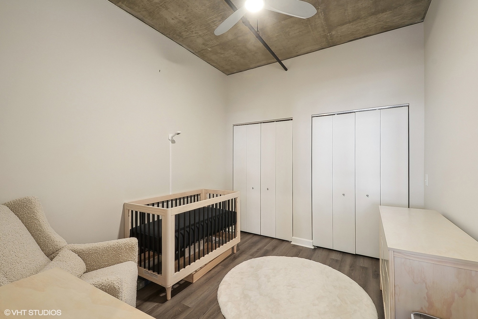 111 South Morgan Street, Unit 607 Chicago, IL 60607 - Photo 8 of 12 a living room with furniture a piano and a ceiling fan