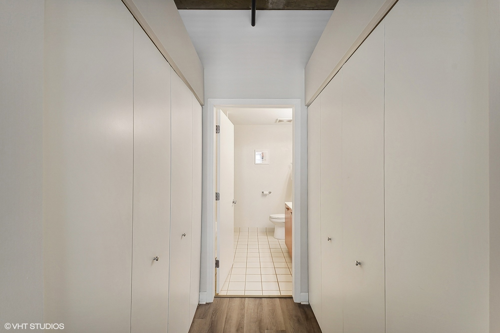 111 South Morgan Street, Unit 607 Chicago, IL 60607 - Photo 9 of 12 a view of a hallway with wooden floor