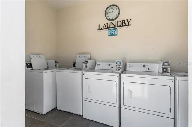 a view of a backyard with swimming pool