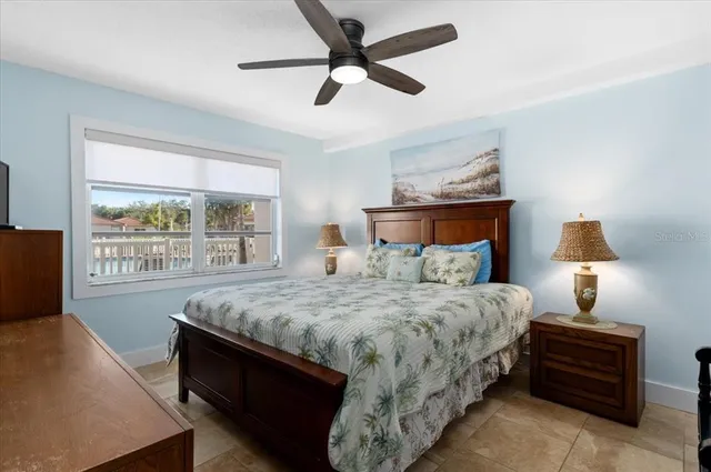 a bedroom with bed and window