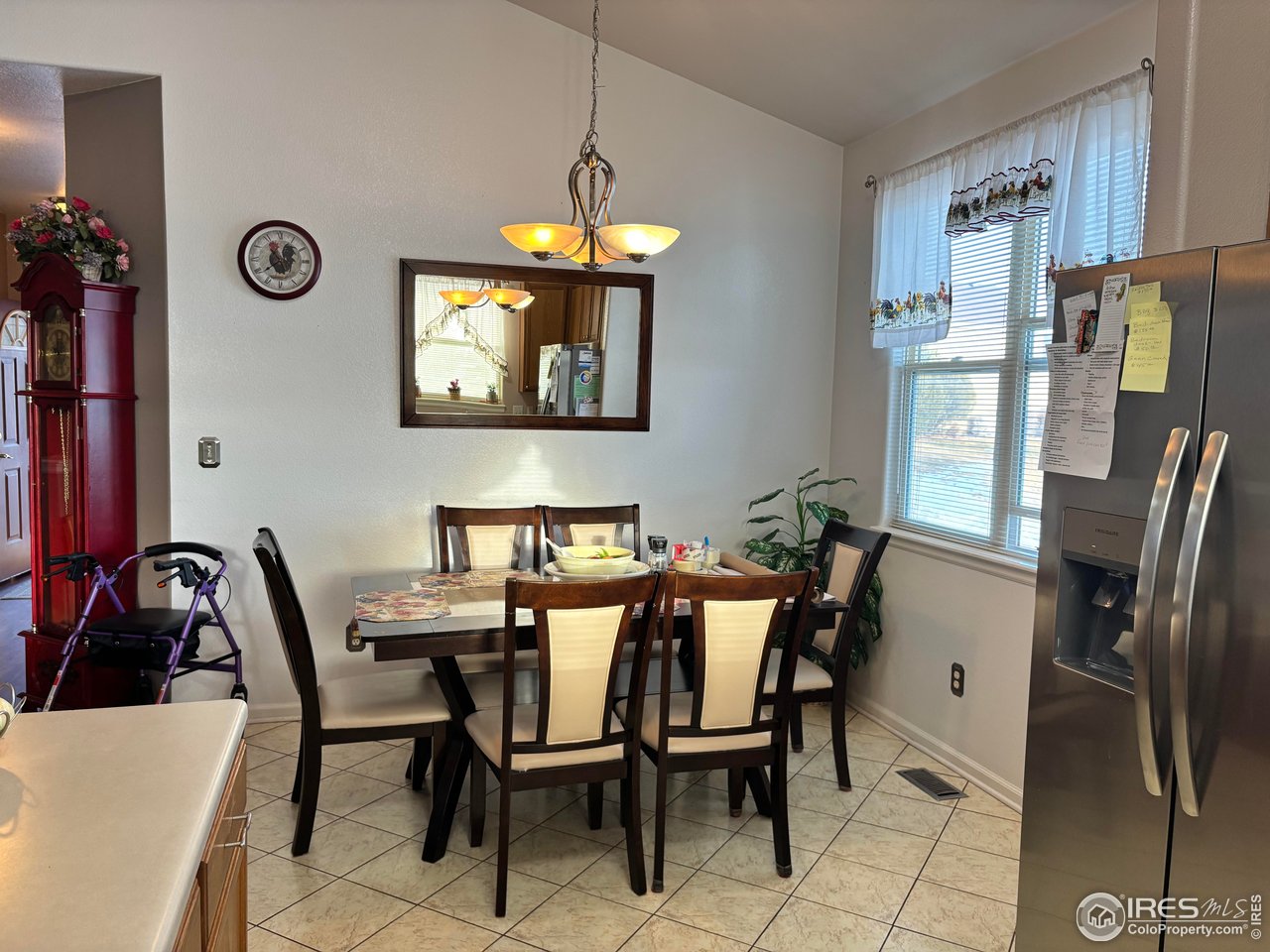 4902 29th Street, Unit 22D Greeley, CO 80634 - Photo 15 of 38 a view of a dining room with furniture and a chandelier