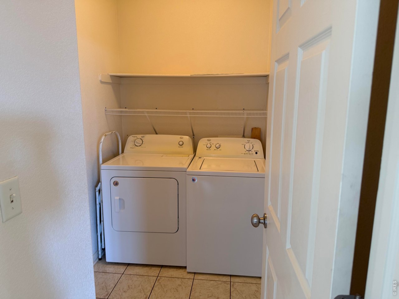 4902 29th Street, Unit 22D Greeley, CO 80634 - Photo 22 of 33 Main floor laundry with lots of cupboard space
