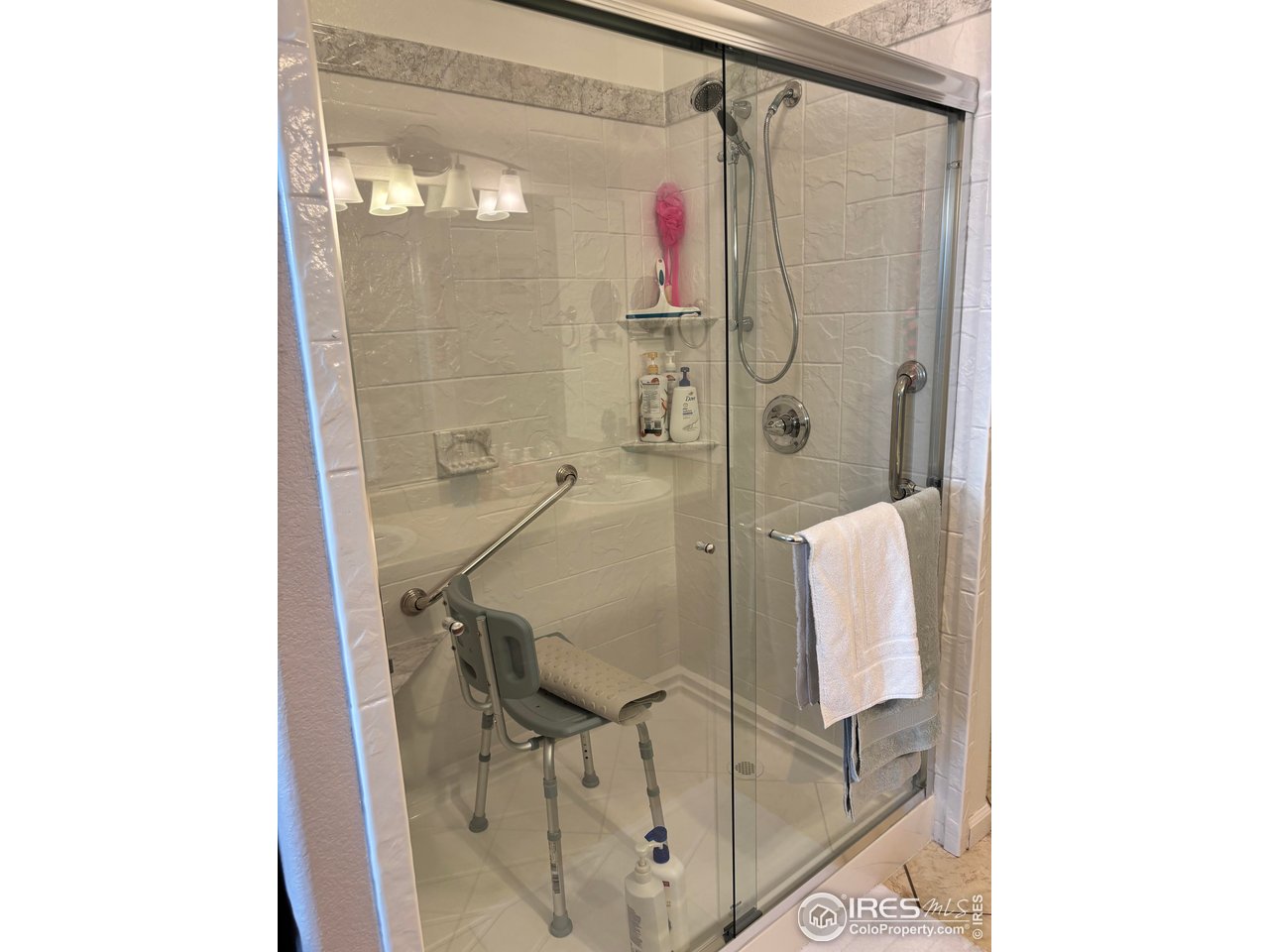 4902 29th Street, Unit 22D Greeley, CO 80634 - Photo 23 of 38 a bathroom with a shower and a sink