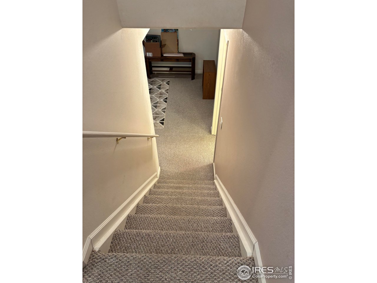 4902 29th Street, Unit 22D Greeley, CO 80634 - Photo 25 of 38 a view of entryway with wooden floor