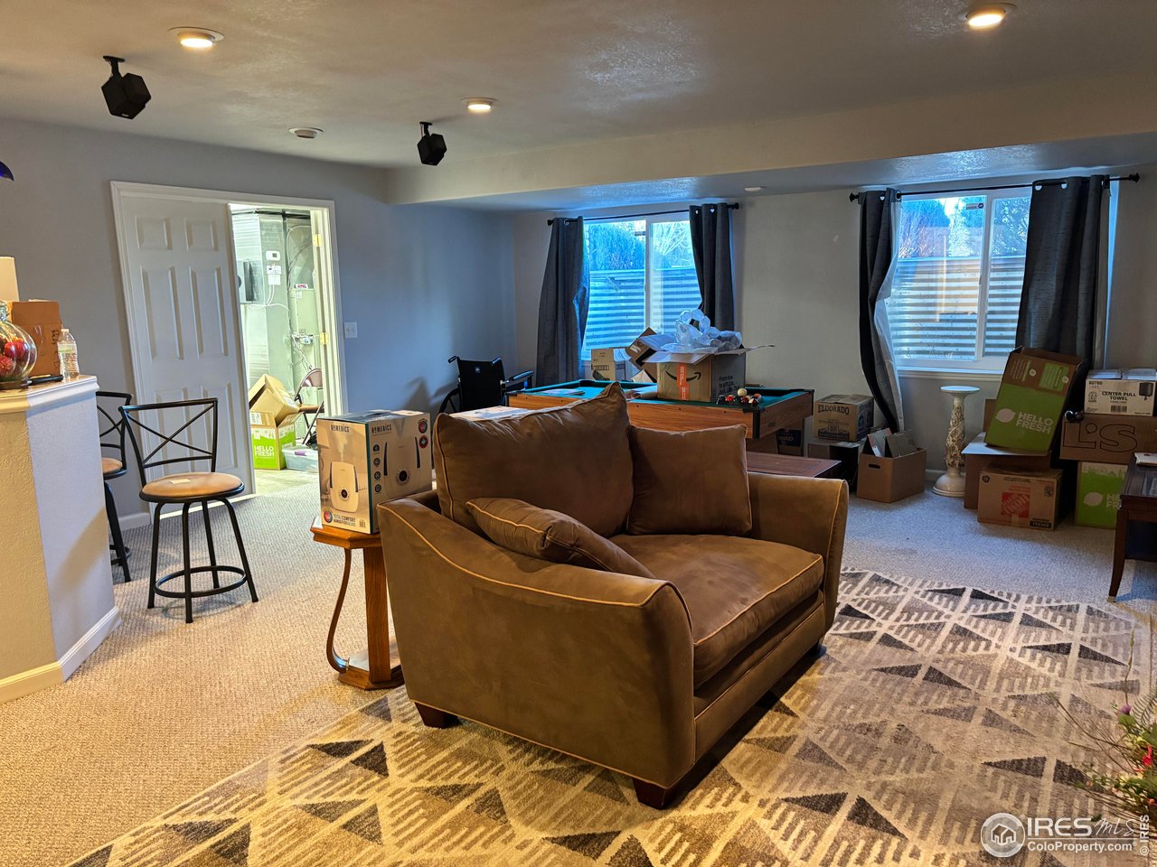 4902 29th Street, Unit 22D Greeley, CO 80634 - Photo 30 of 38 a living room with furniture and a window