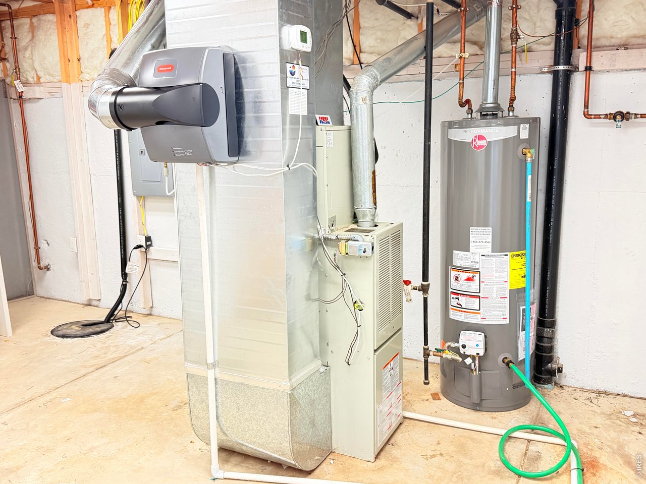 4902 29th Street, Unit 22D Greeley, CO 80634 - Photo 31 of 33 Roomy storage room mega shelving w/ newer water heater furnace & humidifier