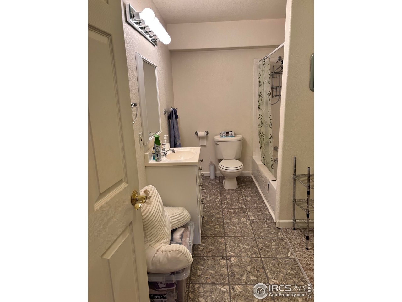 4902 29th Street, Unit 22D Greeley, CO 80634 - Photo 33 of 38 a bathroom with a toilet and a mirror