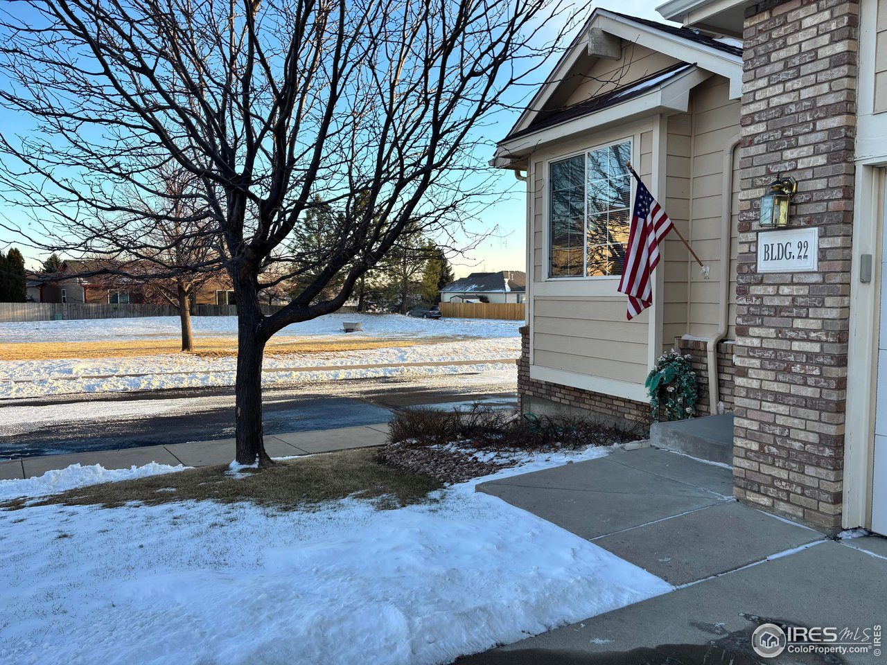 4902 29th Street, Unit 22D Greeley, CO 80634 - Photo 37 of 38 a view of a house with backyard and trees