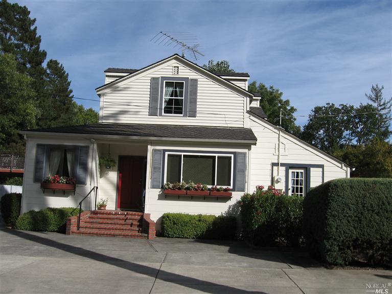 102 Butterfield Road San Anselmo, CA 94960 - Photo 1 of 1 a front view of a house with a yard
